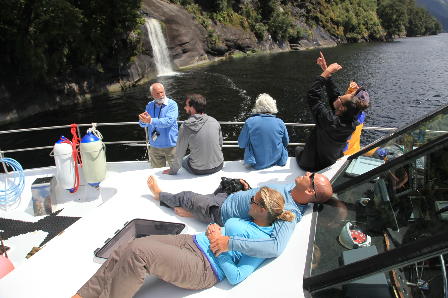 Boat deck looking across the still waters and cliffs of Doubtful Sound
