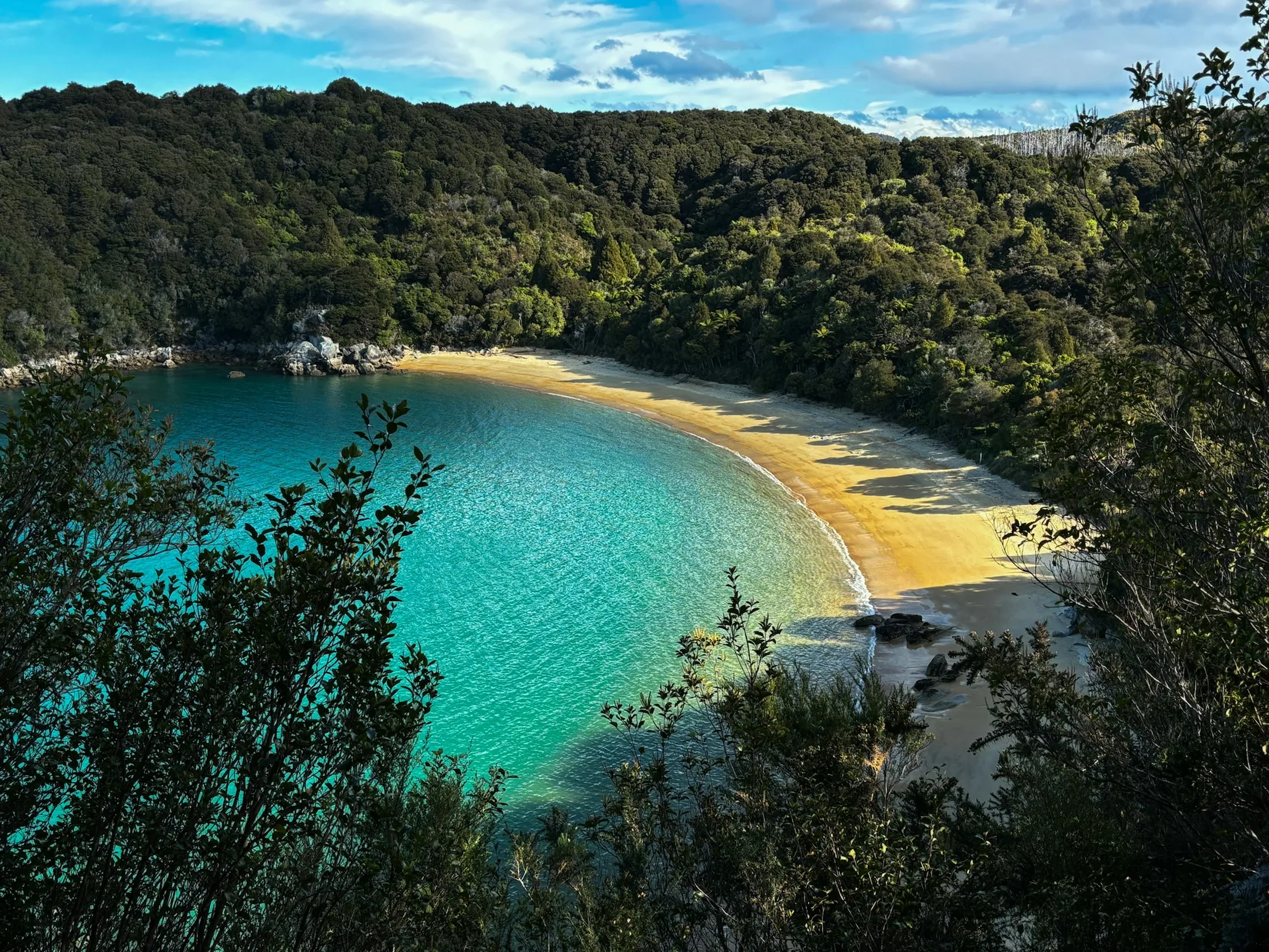 Boats resting near a golden Abel Tasman beach
